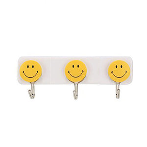 Colorful smiley face hooks for decorative wall hanging.