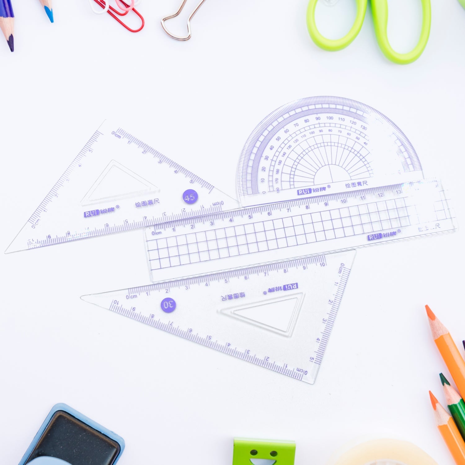 Ruler set including various drafting tools for students and office use.