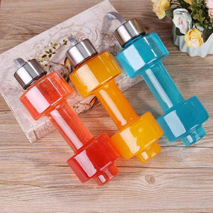 Steel cap plastic dumbbell-shaped water bottle for workouts and hydration.